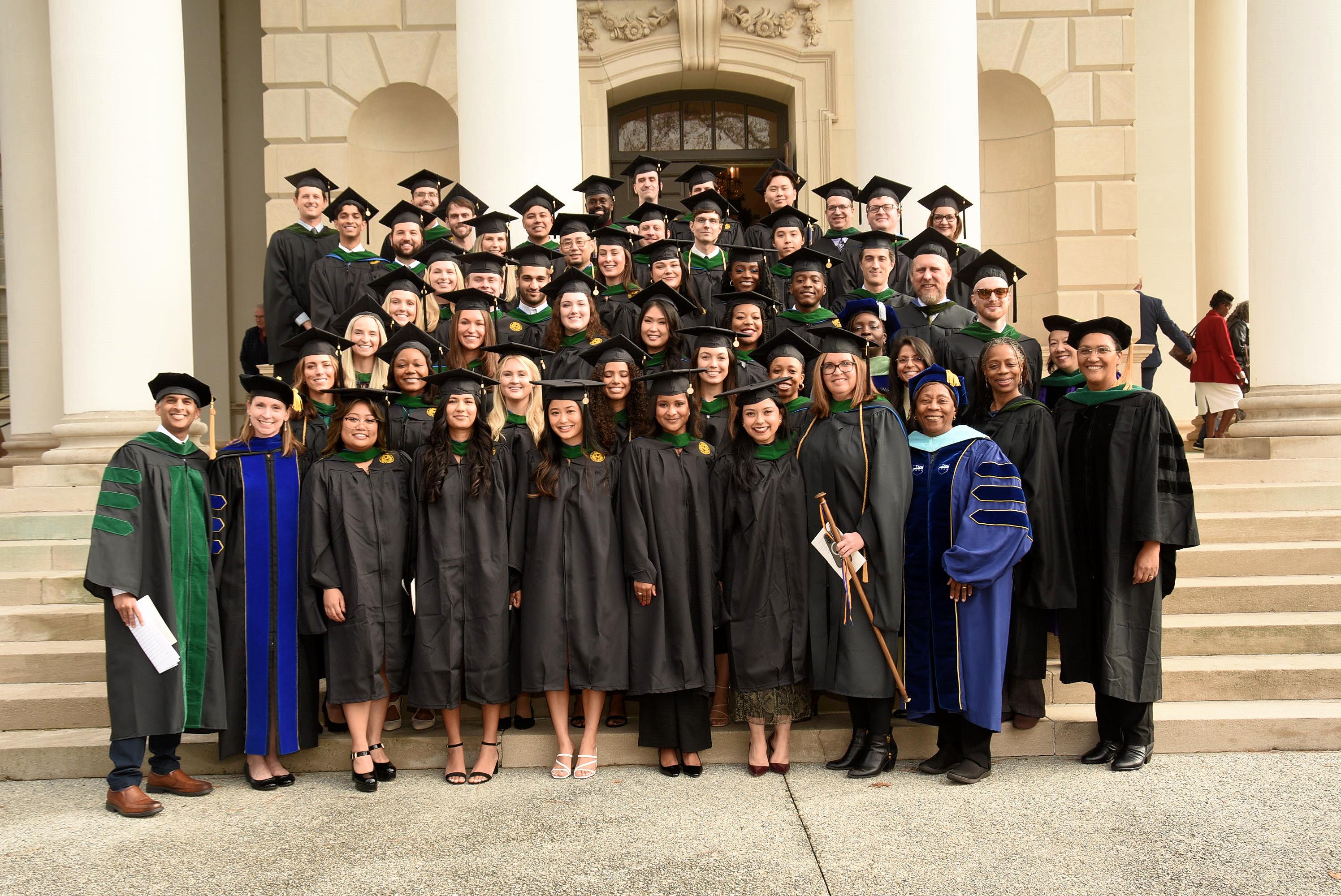 large group of graduates standing on steps