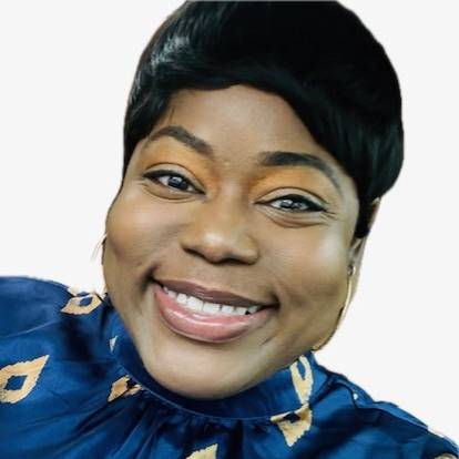 headshot of a woman with short, black hair wear a blue and gold shirt smiling