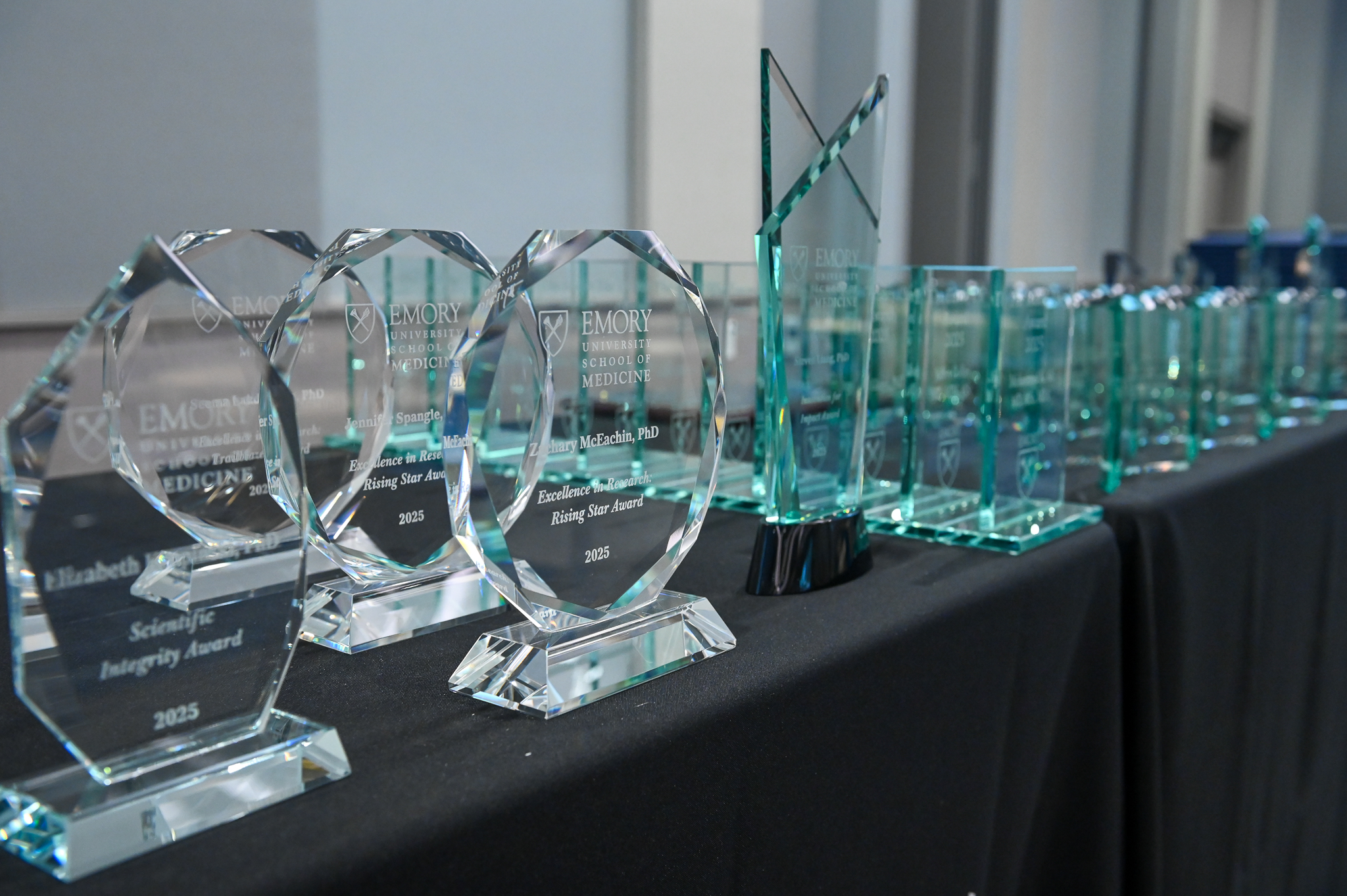 Glass awards sit on a table. 
