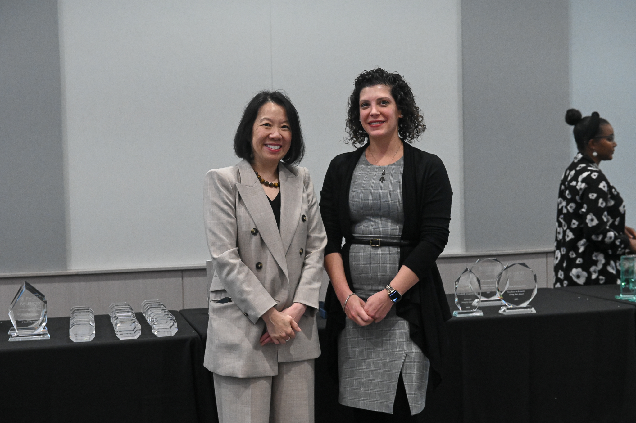 Faculty member smiles for photo with dean.