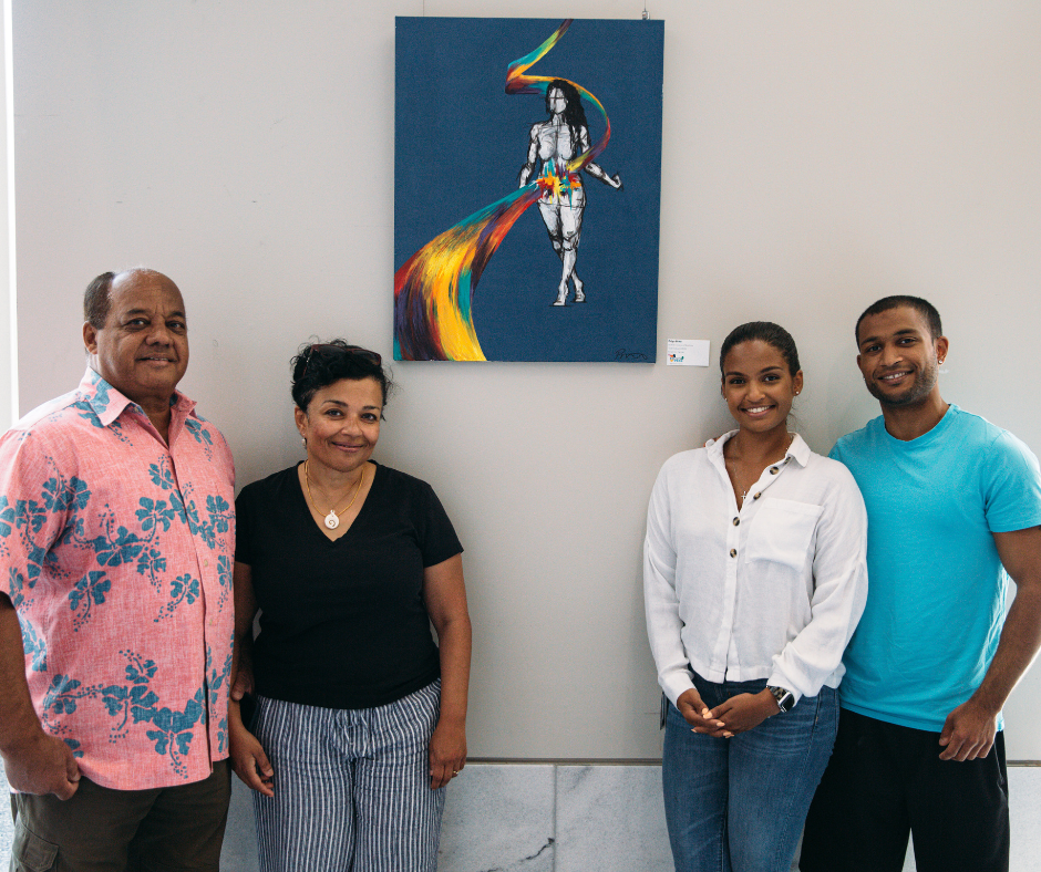 Student and her family stand in front of her artwork 