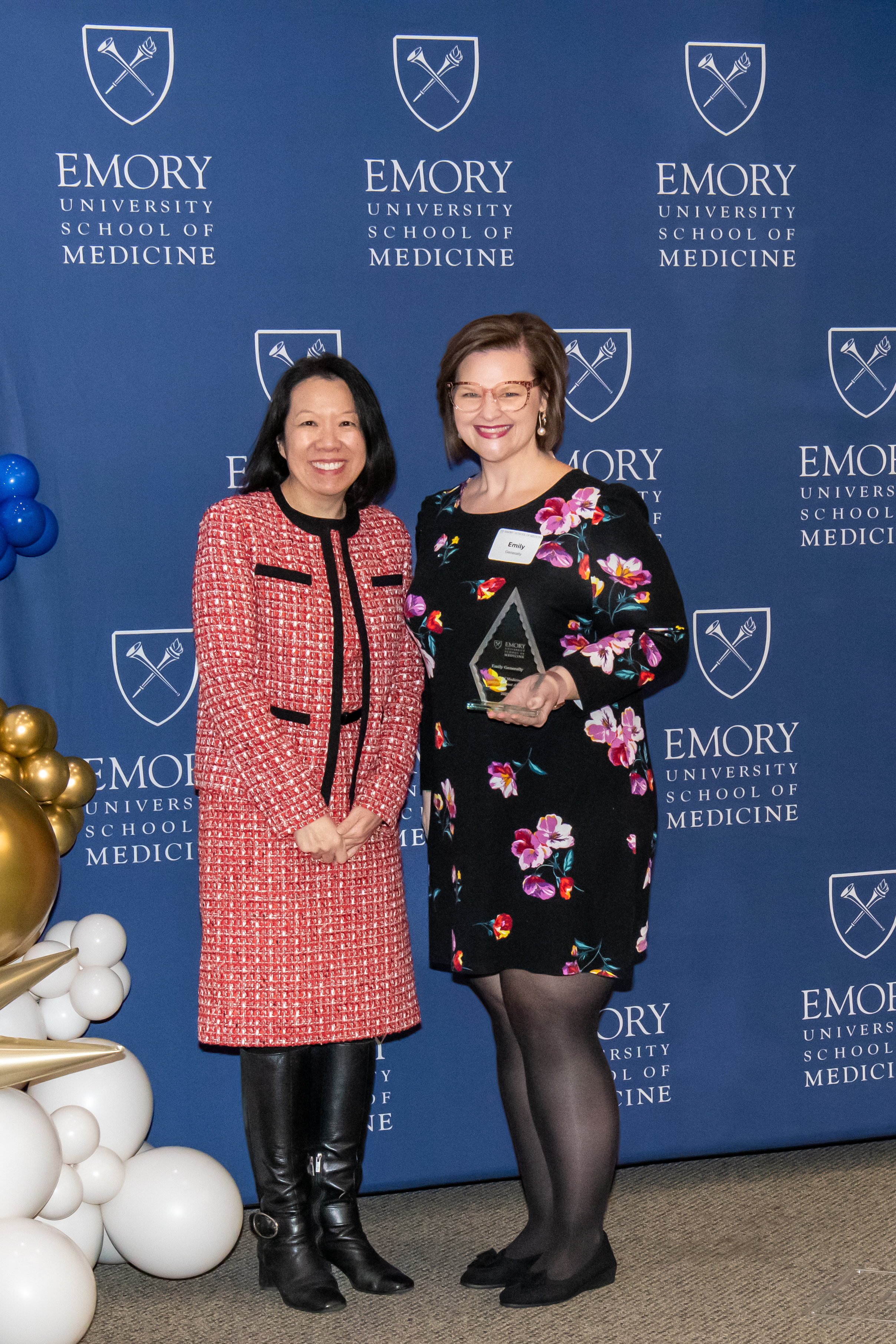 Emily Generally accepting her award with Dean Wong.
