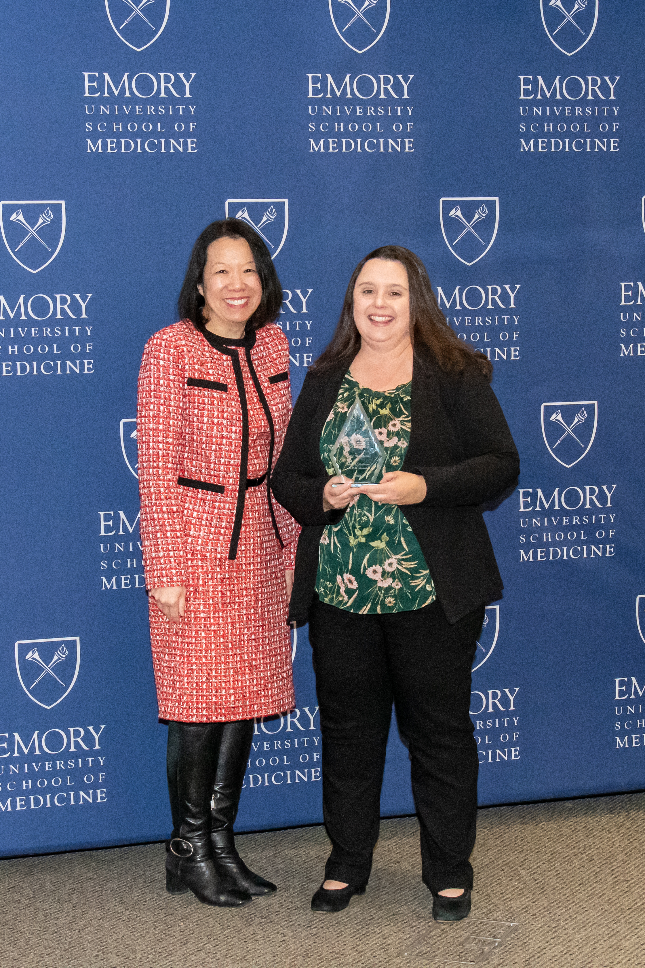 Tracy Niedzielko accepting her award with Dean Wong.