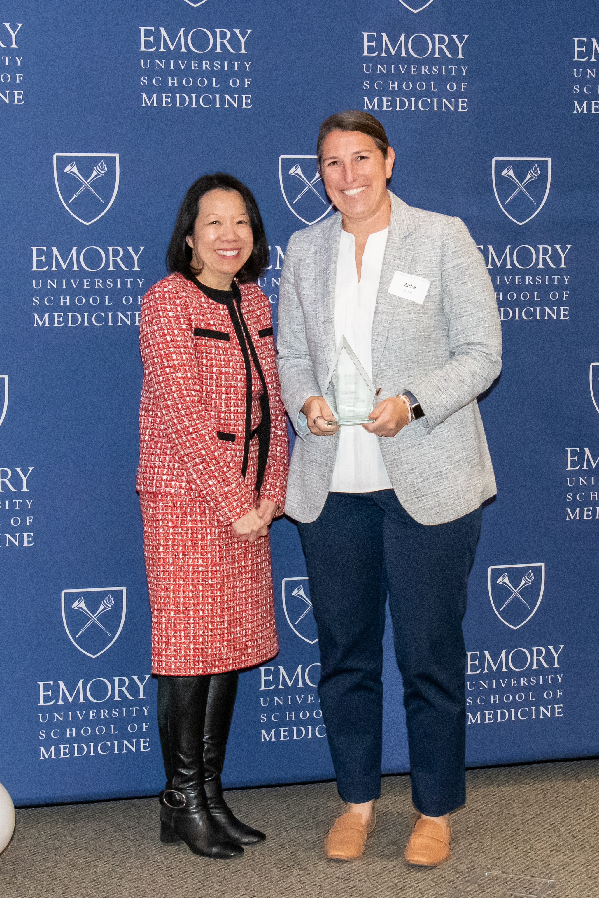 Zirka Smith accepting her award with Dean Wong.