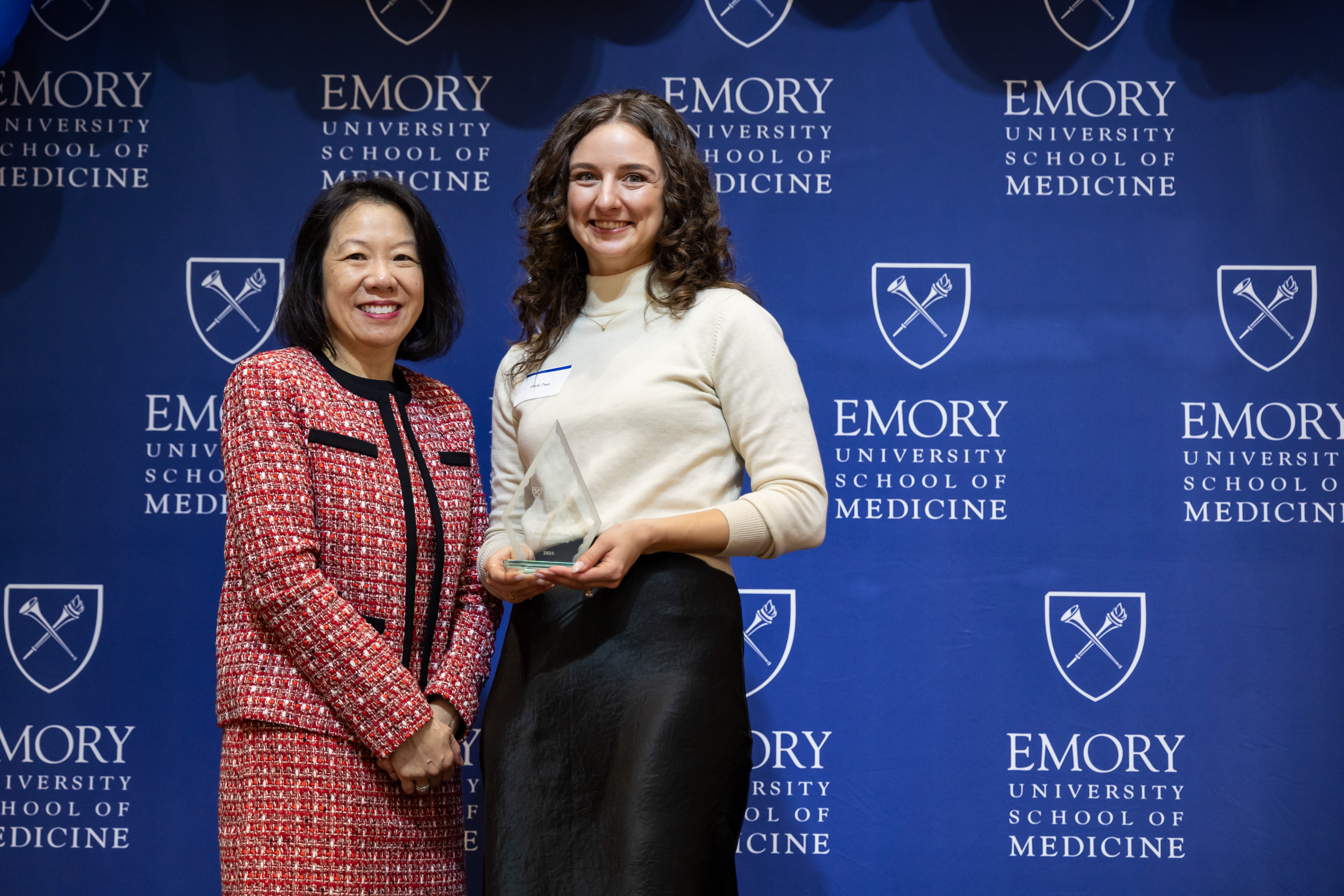 Emily Twa accepting her award with Dean Wong.