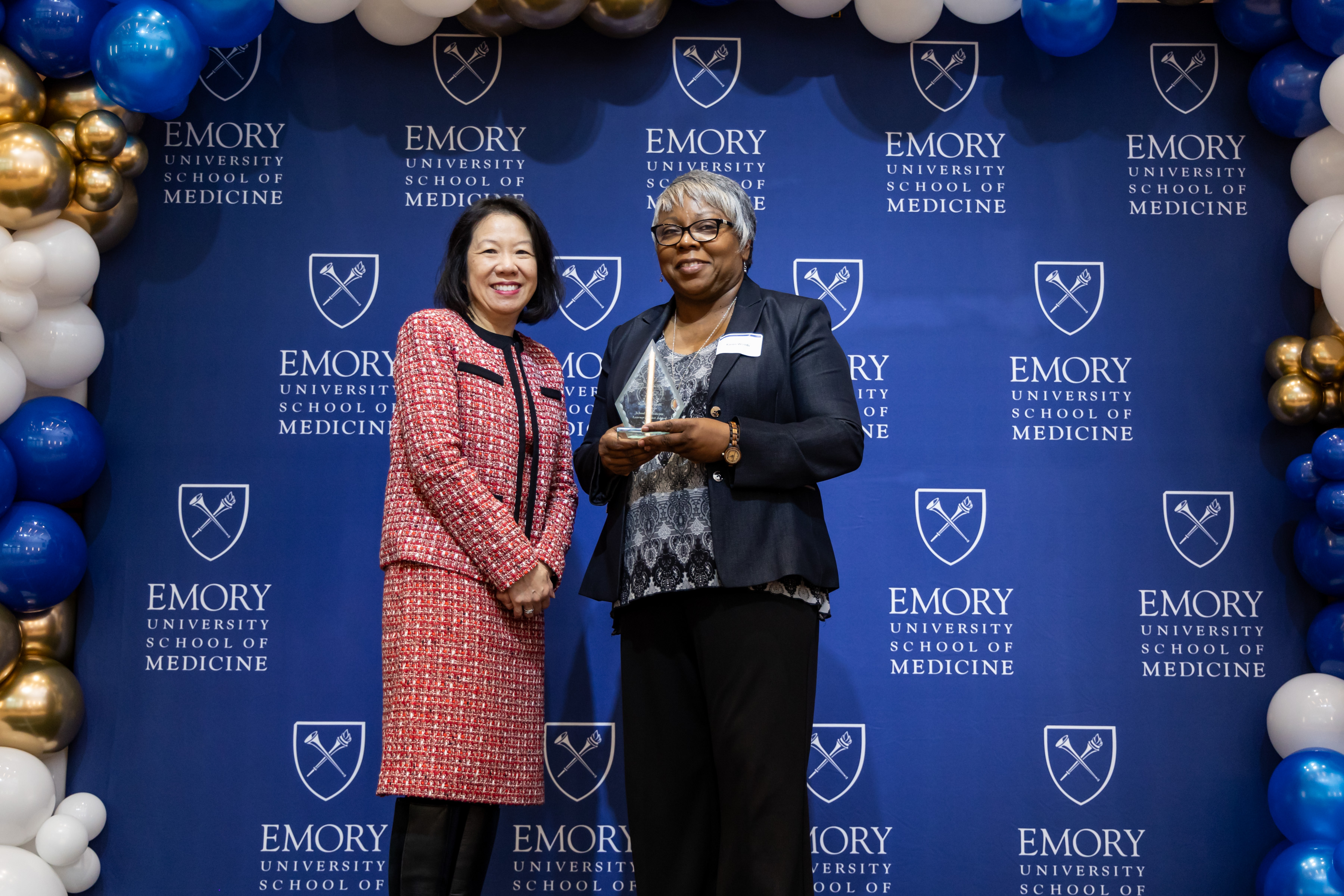 Karen Woods accepting her award with Dean Wong.