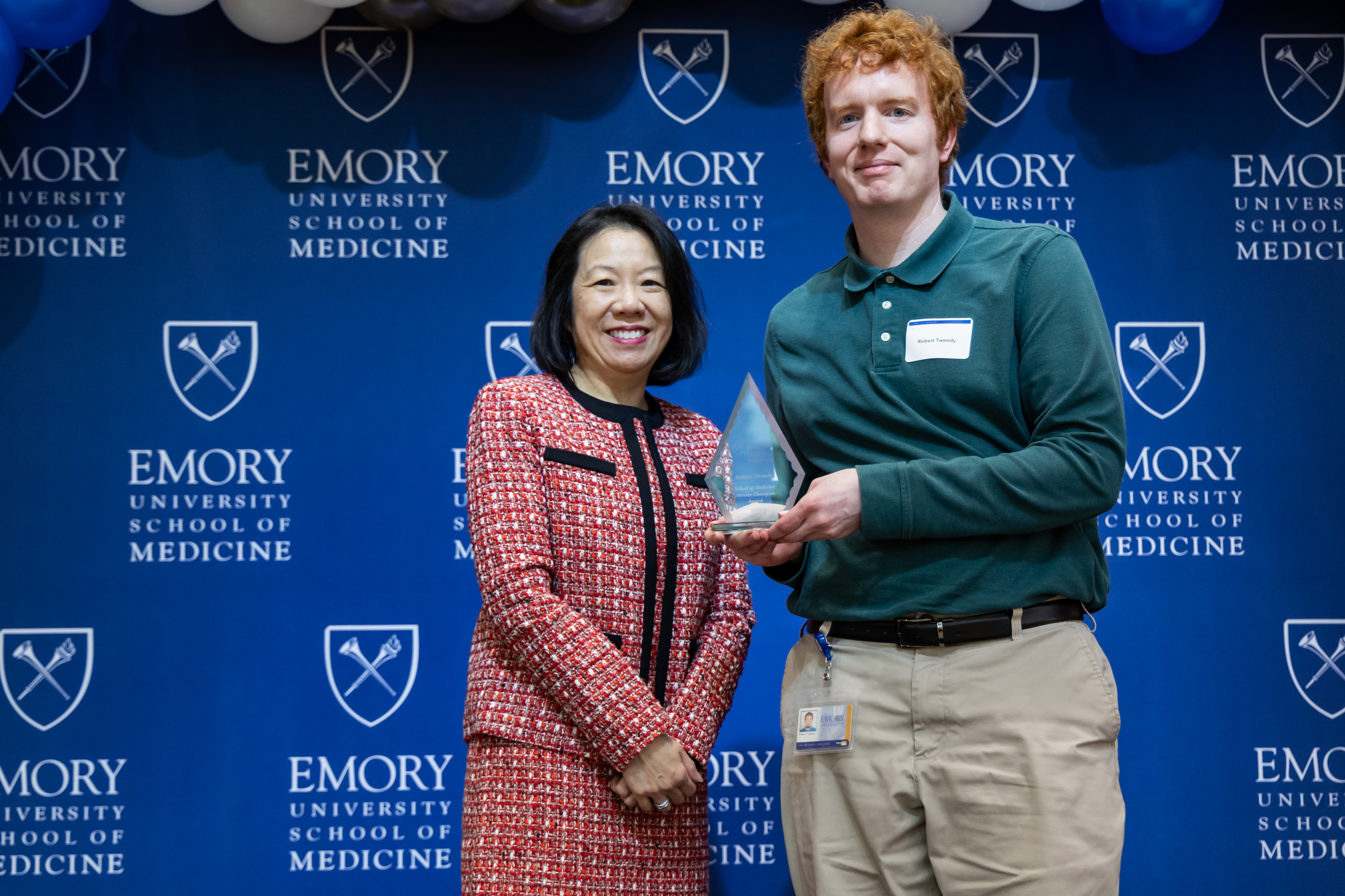 Robert Tweedy accepting his award with Dean Wong.