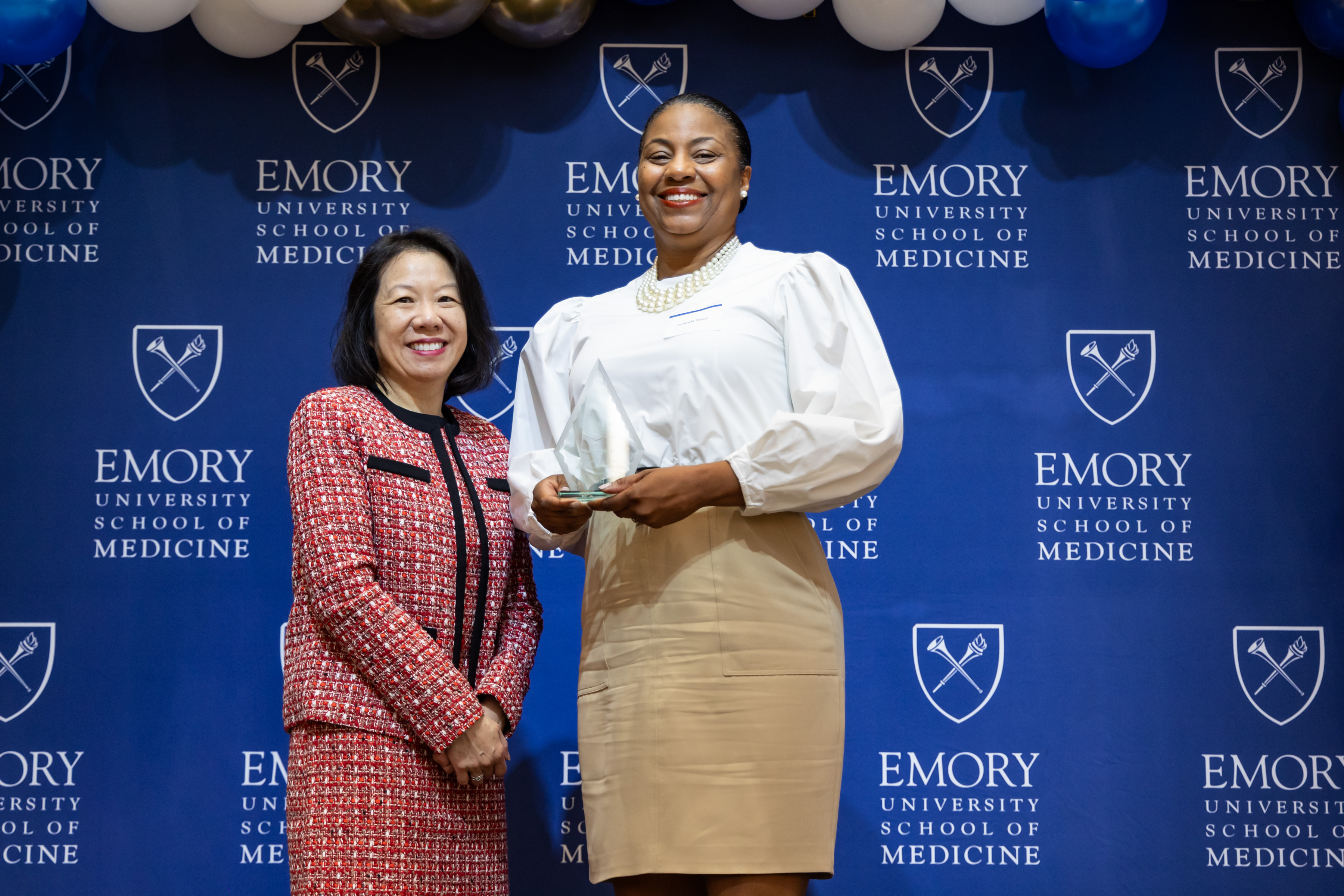 Yolanda Hood accepting her award with Dean Wong.
