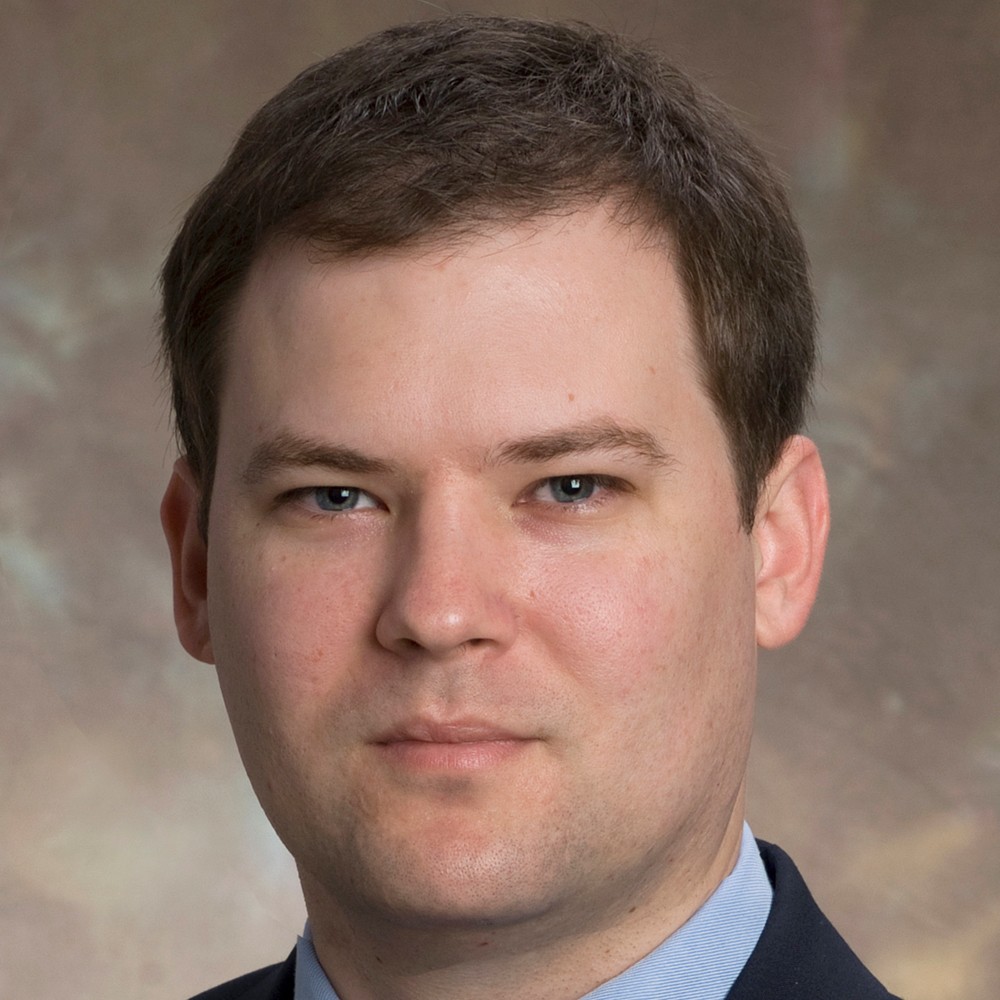 Headshot of man in suit