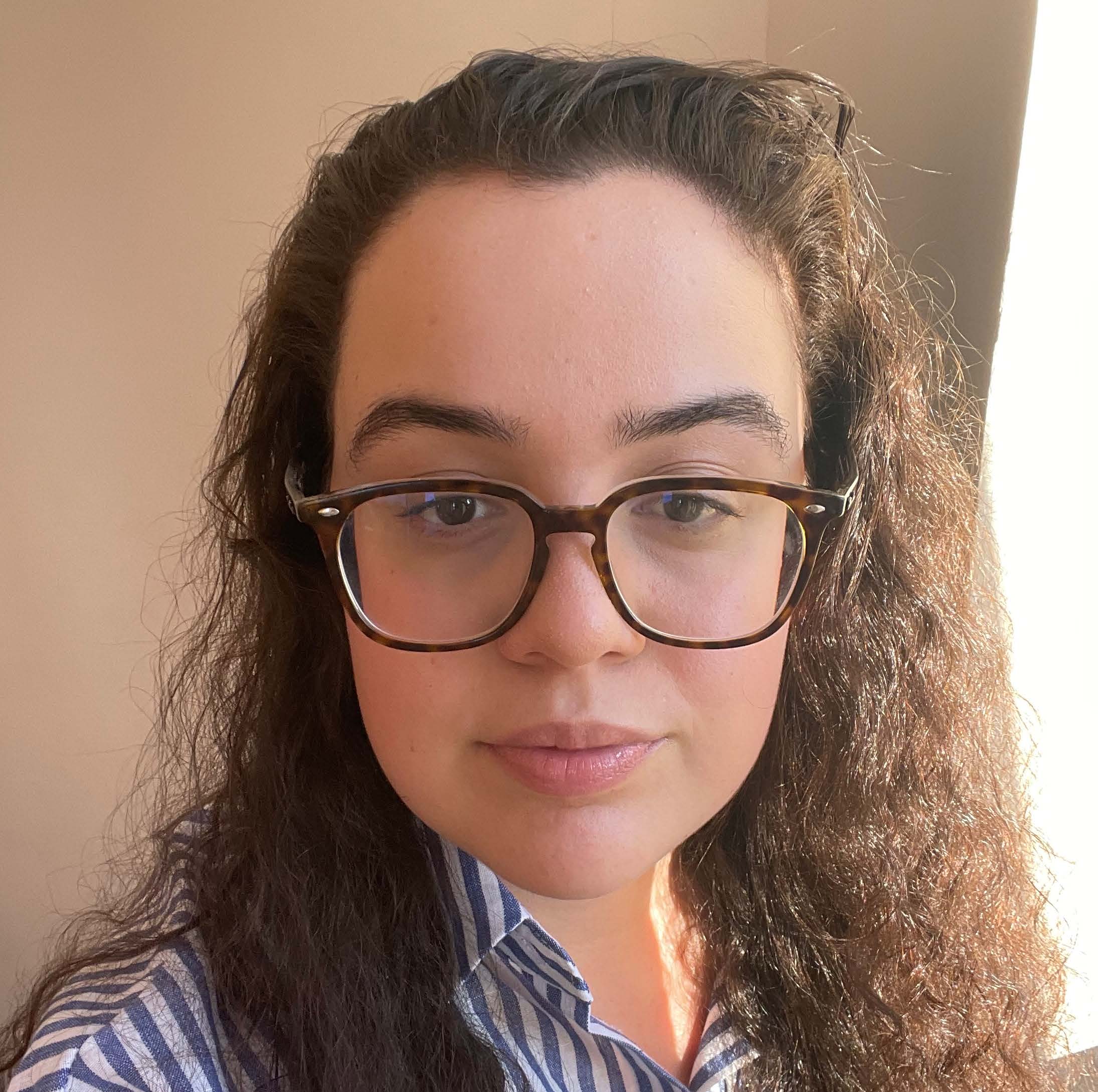 headshot of woman with glasses