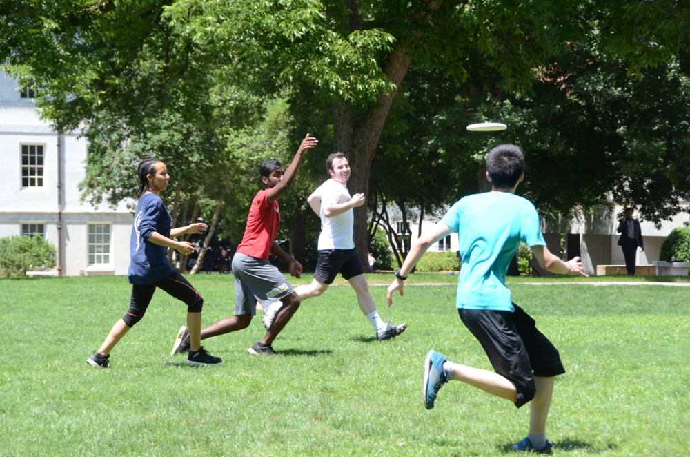 Liang Lab event image 2023, running in a field on Emory campus