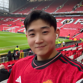 man with soccer field in background