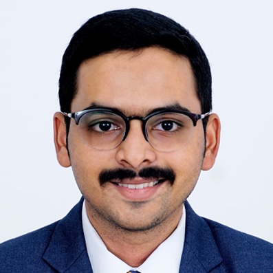 headshot of man with suit