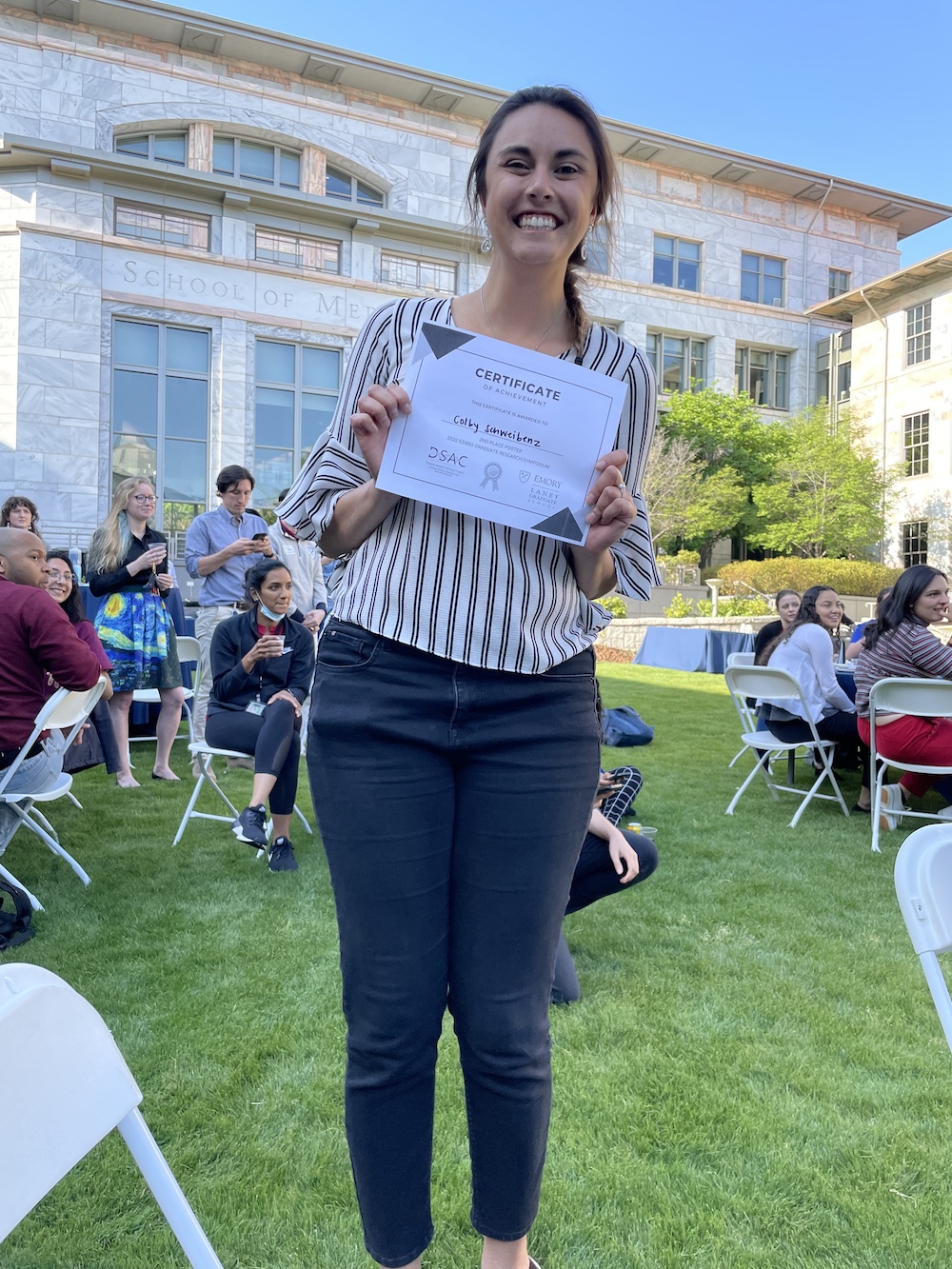 Colby with certificate of achievement