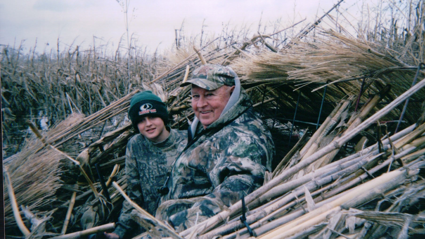 young boy and old man in camouflage