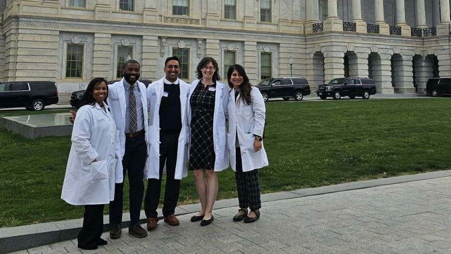 Dr. Sarah Dupont and PMR residents in front of US Capitol Building