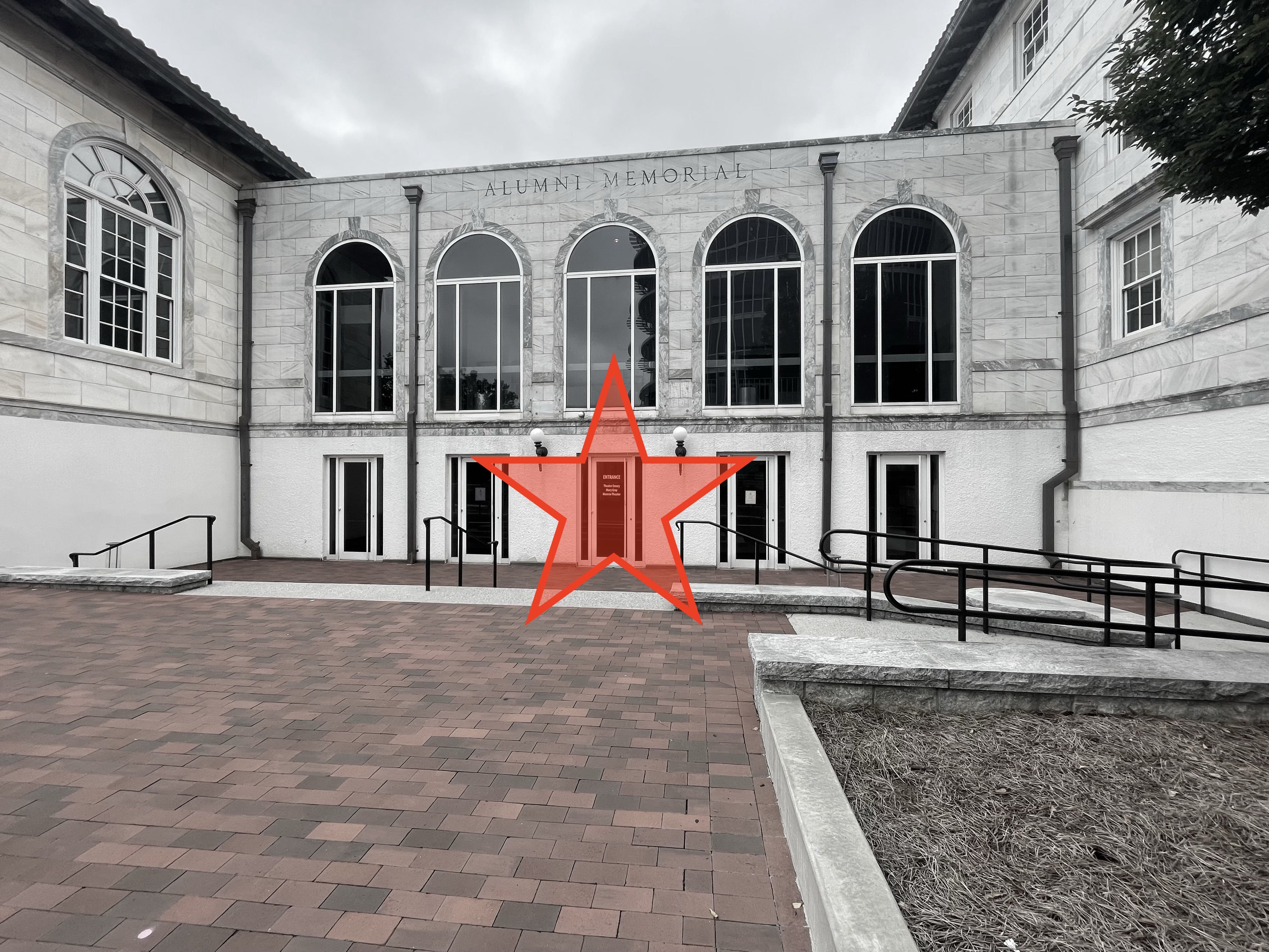 Picture of a building entrance with a yellow star.