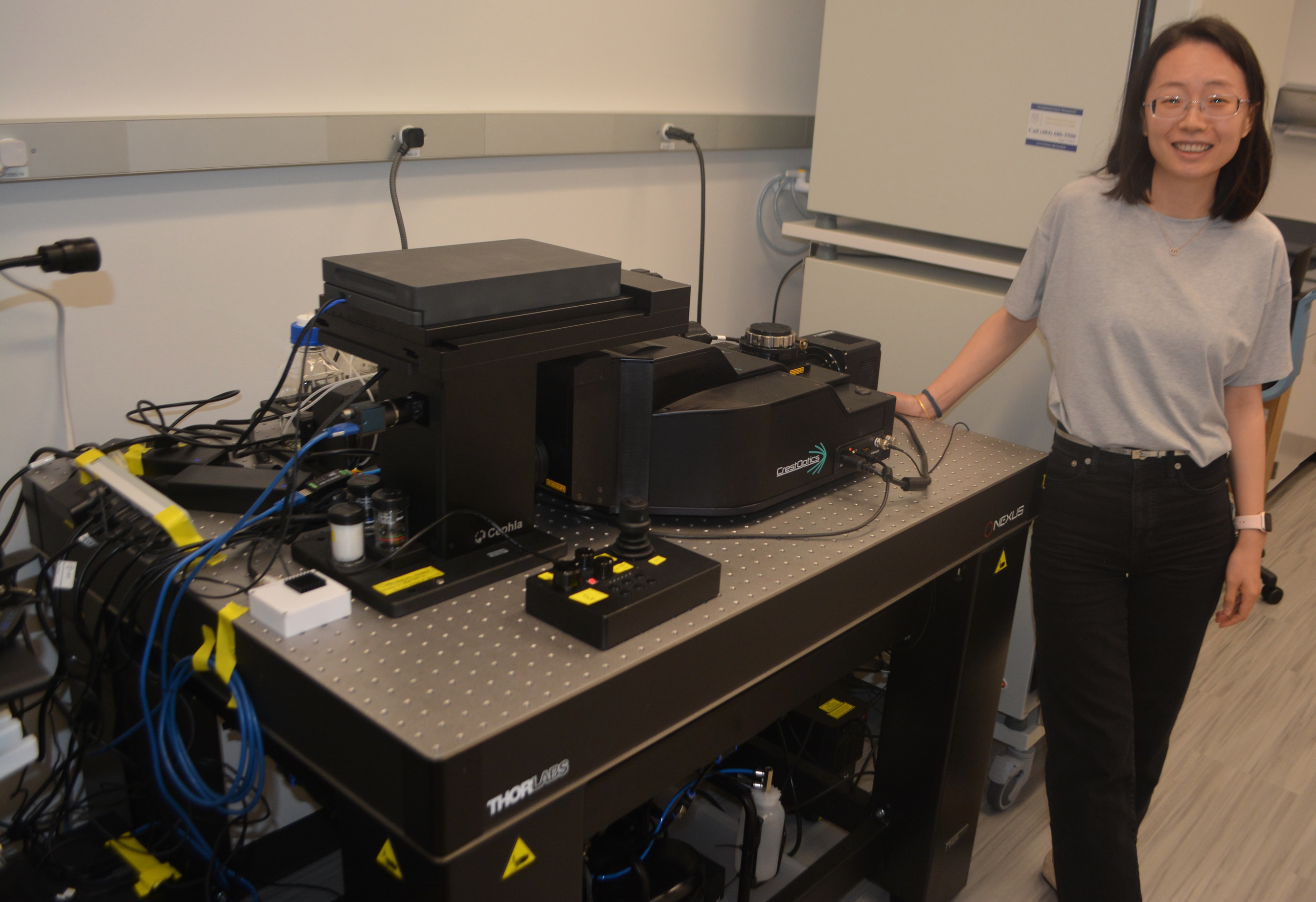 Hailing Shi, PhD, in her HSRB2 lab with custom microscope setup