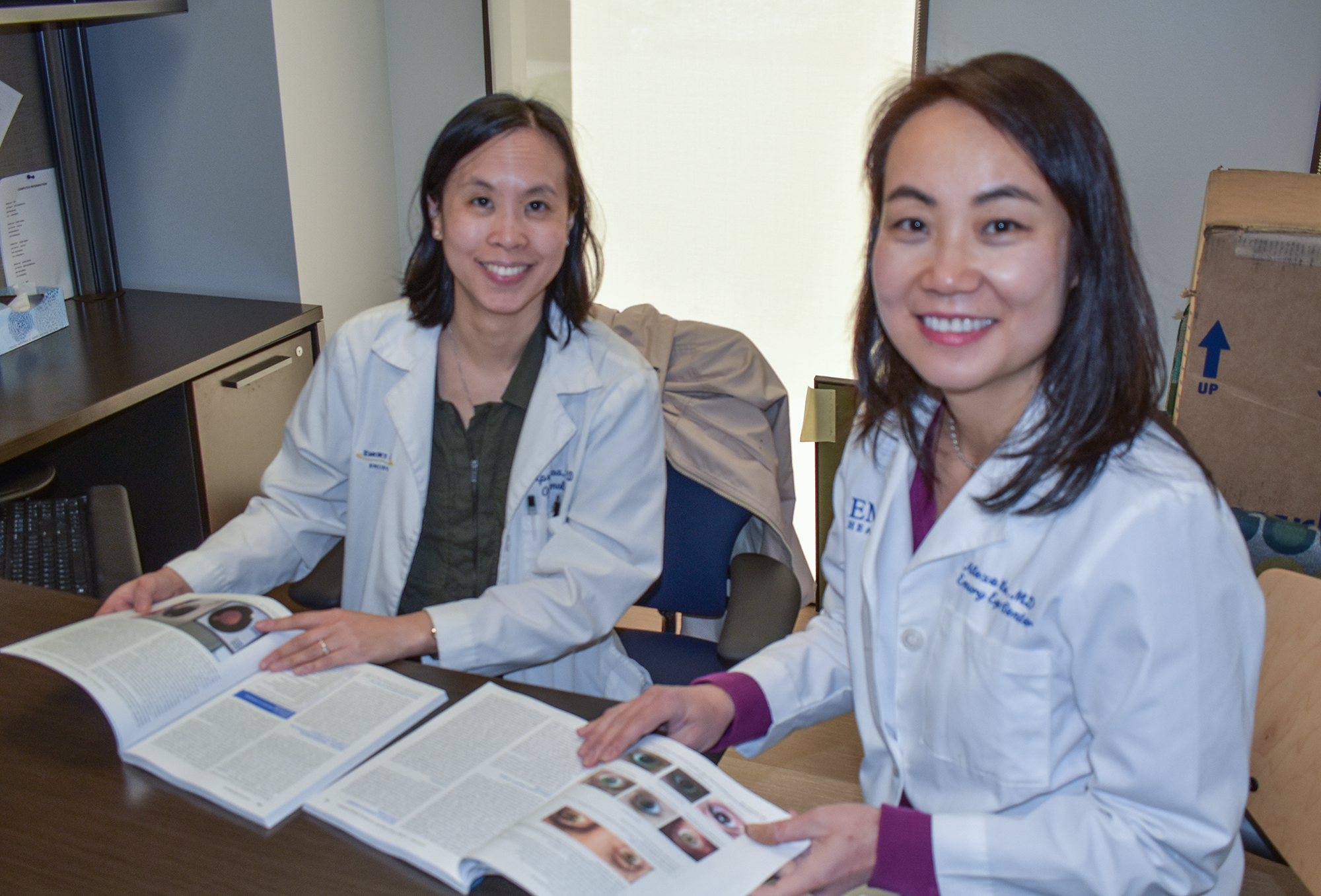 Emory Eye Center doctors   Alexa Lu and April Maa, authors of a textbook on telehealth