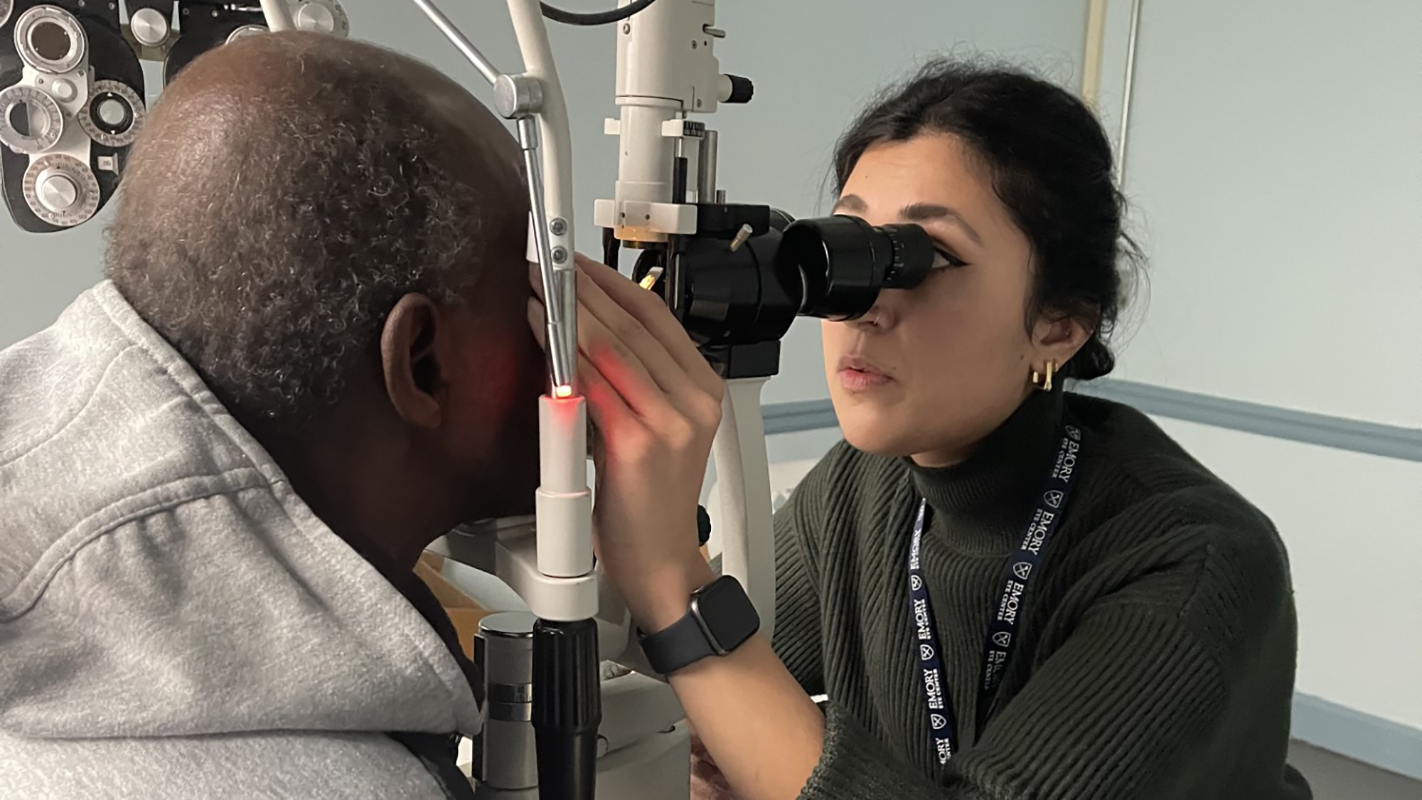 An ophthalmologist examining a patient's eyes 