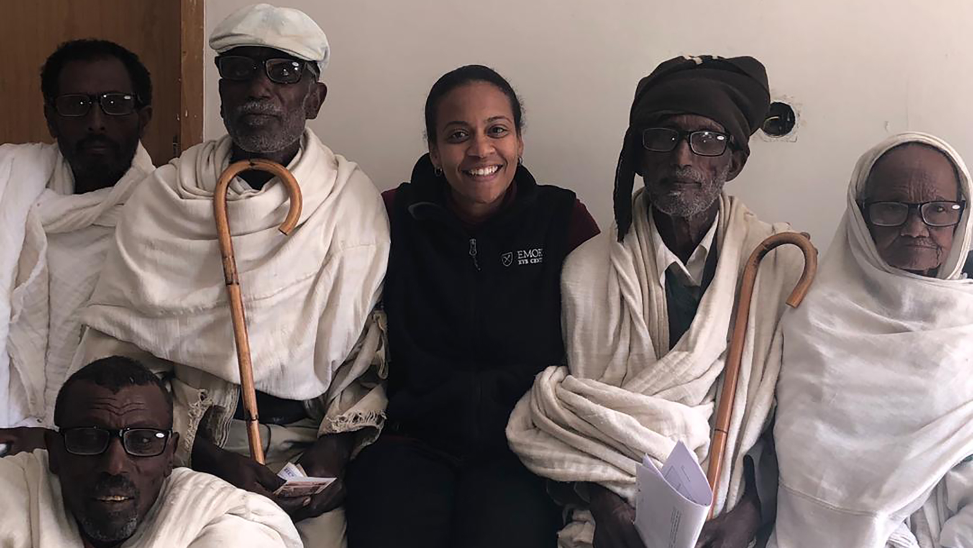 four people - 3 men, 1 woman - staff and patients of a GO-E clinic in Ethiopia