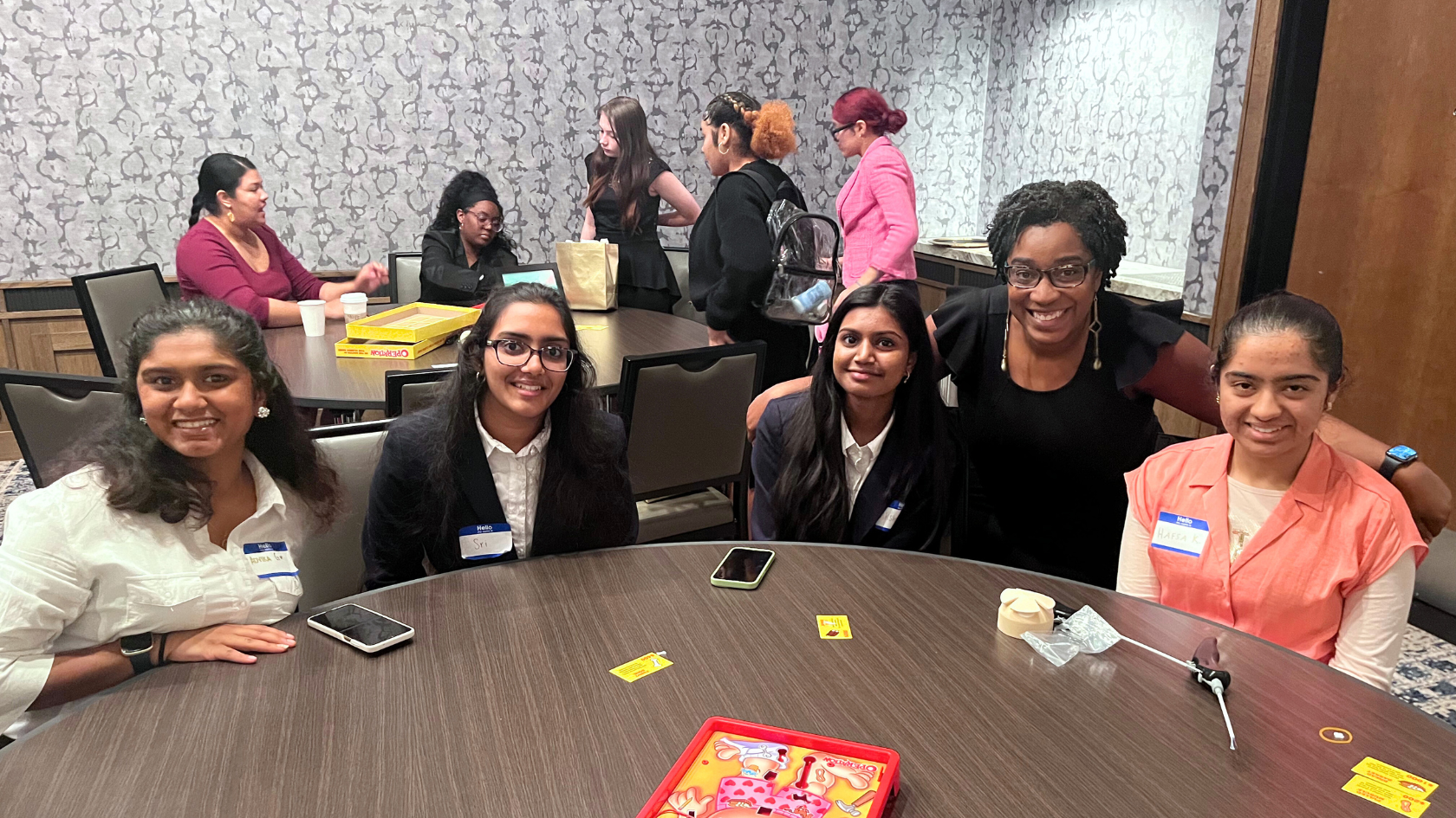 Dr. Hill and a group of students at an event