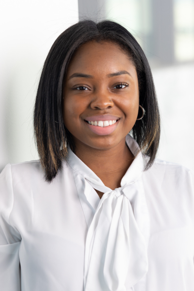 A portrait photo of Mia Harvey