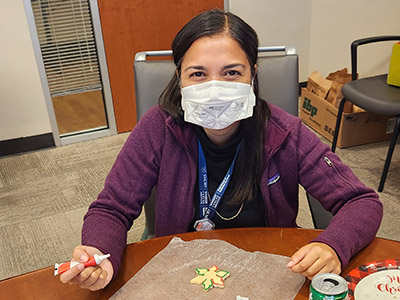 Dr. Kesarwala decorates holiday cookies.