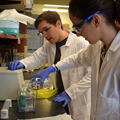 Dr. Brent Jones with cancer biology student Sayalee Potdar. at the NASA Space Radiation Laboratory.