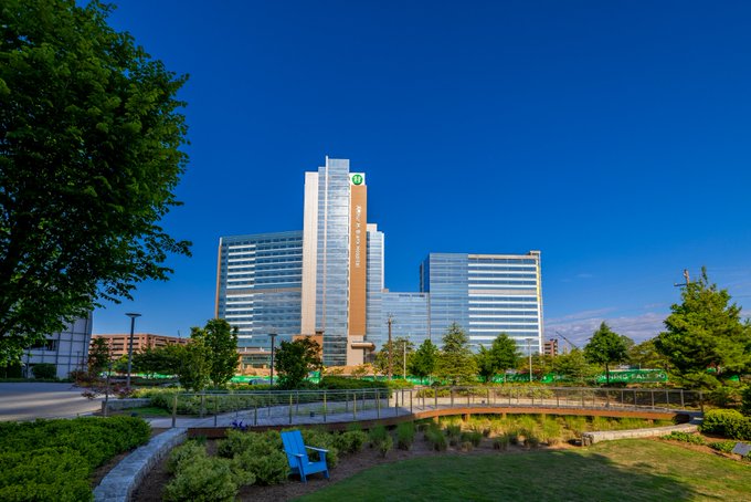 Tall hospital as seen from a grassy area