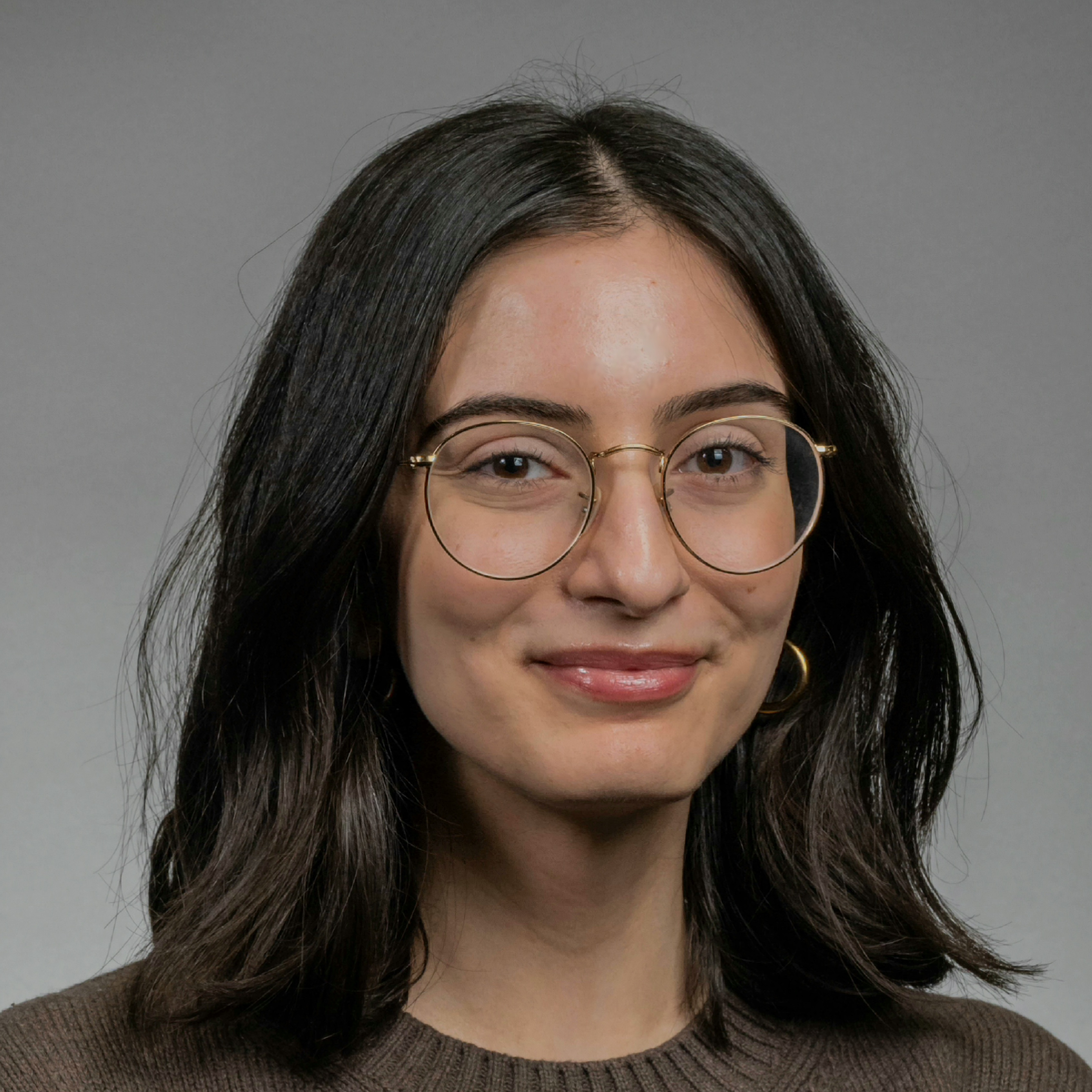 headshot of woman with black hair