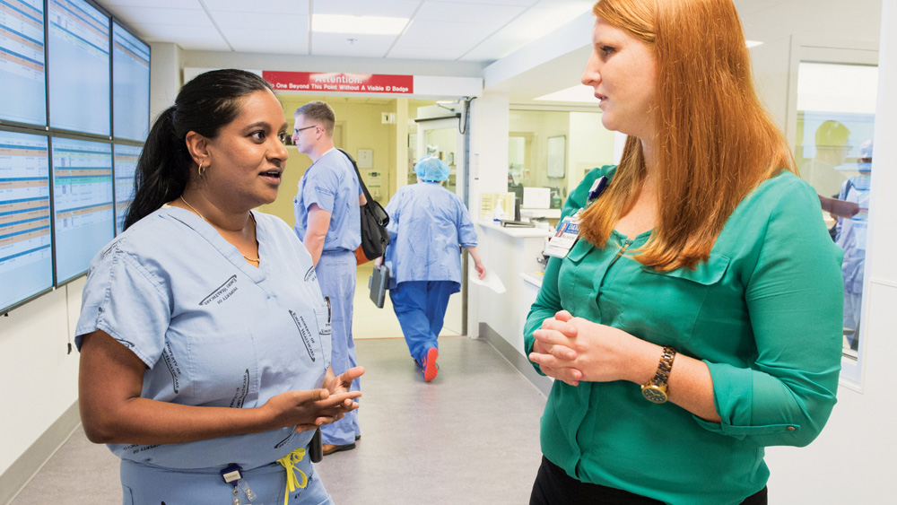 Dr. Srinivasan and an OR staff member.