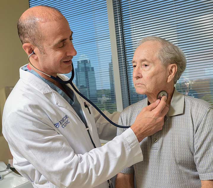 Dr. Joseph Zarge in clinic with a patient.