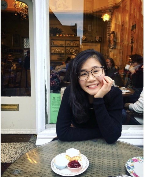 Wendy Lee sitting at table and smiling