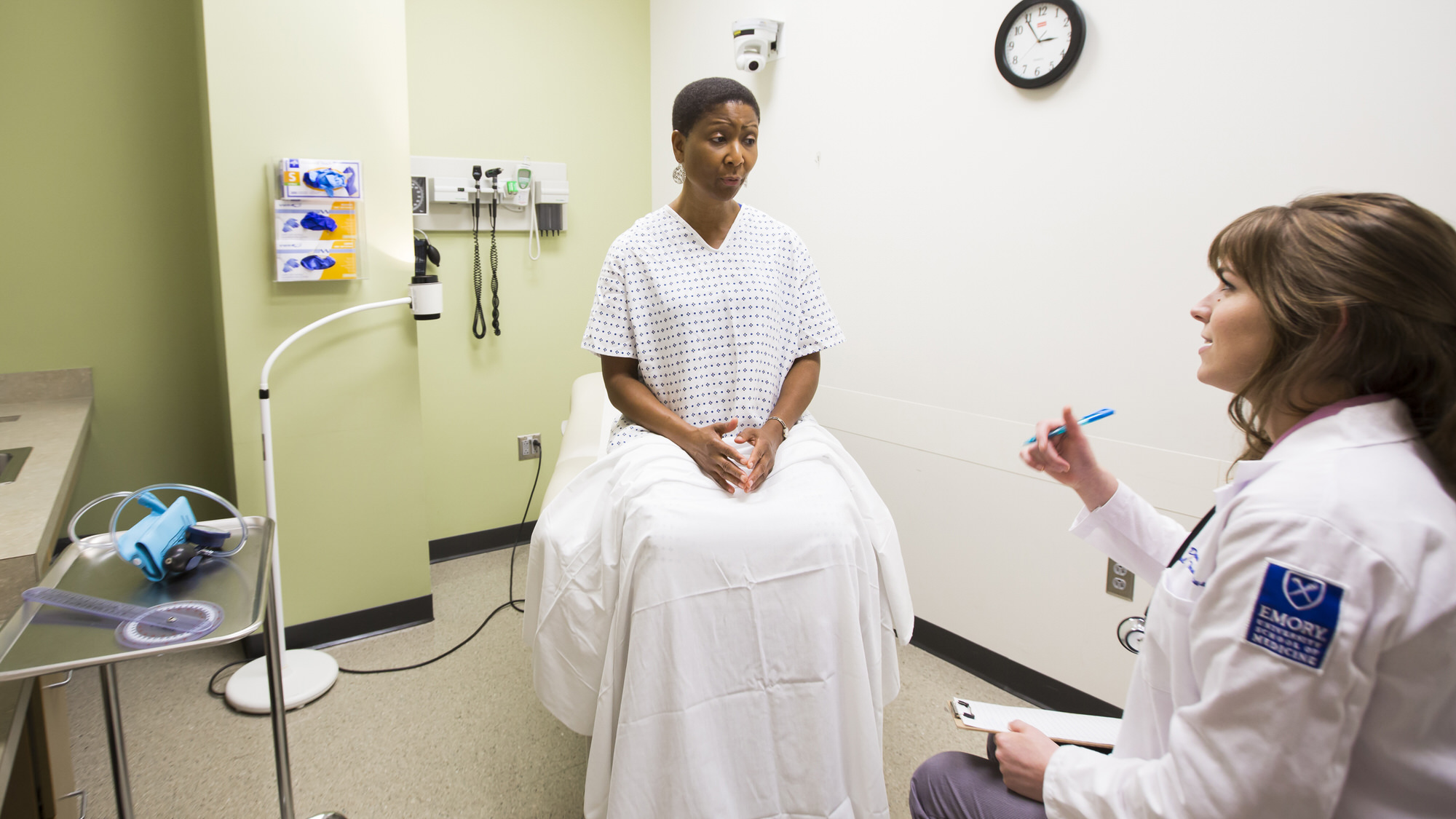 Student talking to a patient