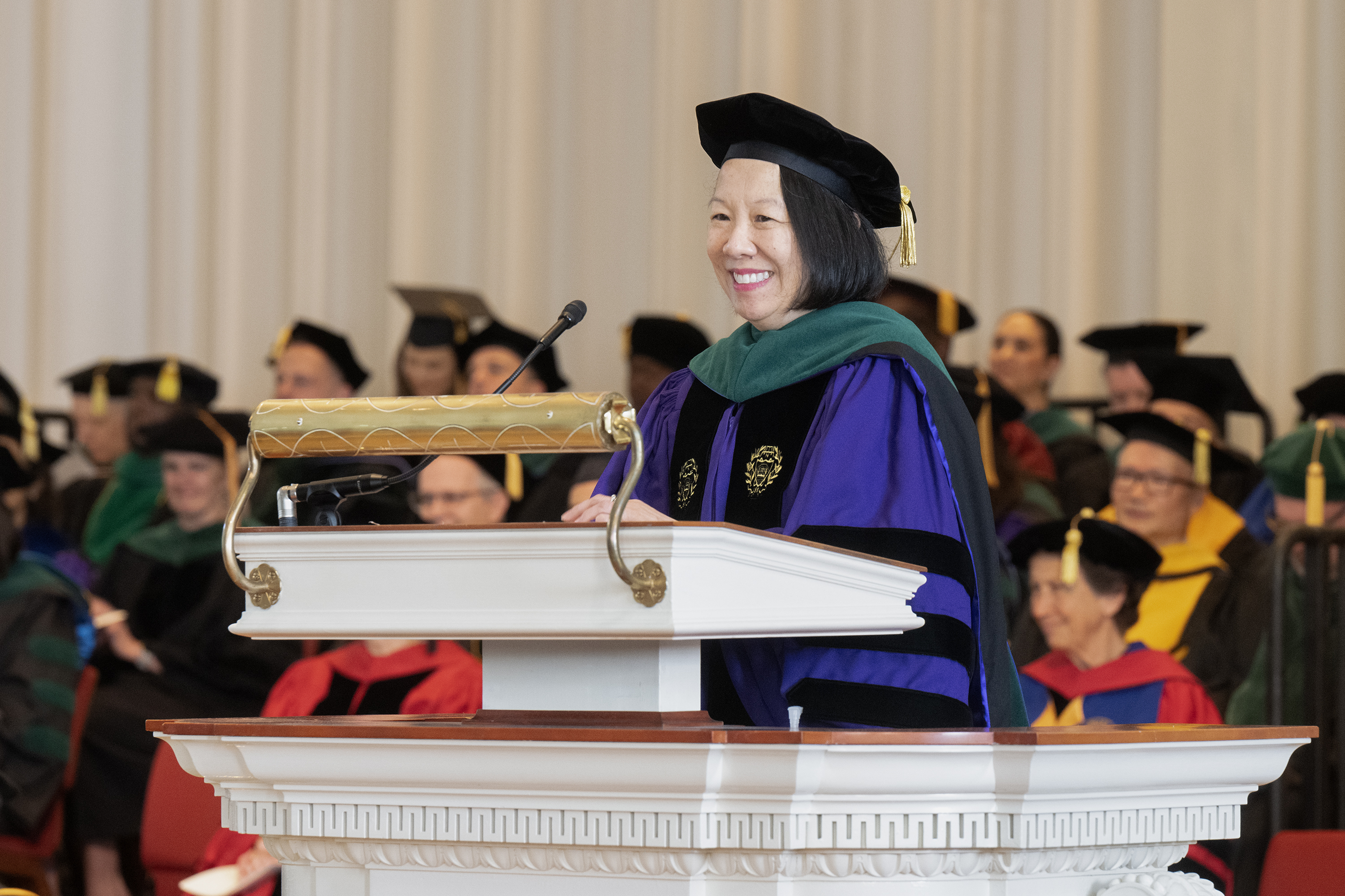 Dean Wong at podium during medical school graduation