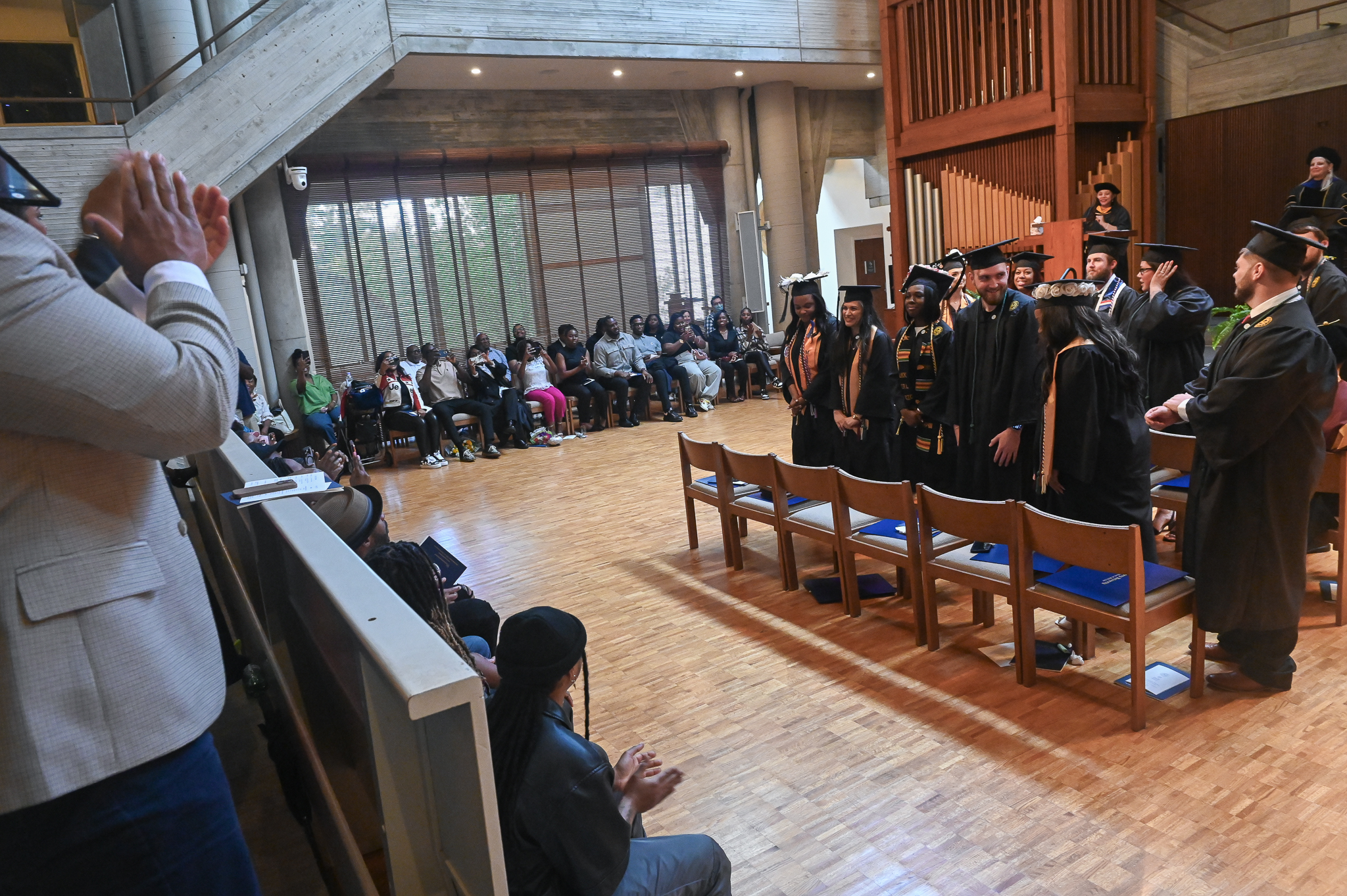 Audience gives standing ovation to Medical Imaging graduates.