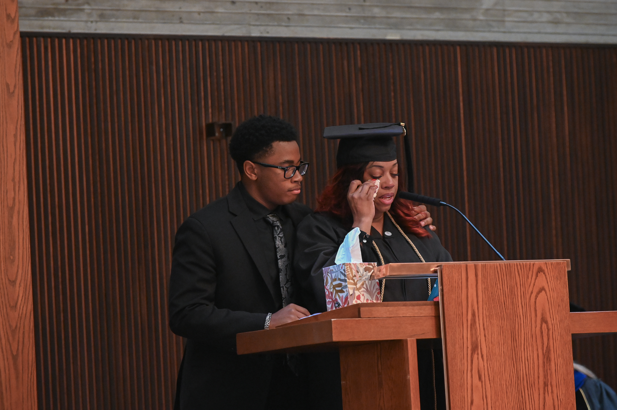 LaToya Gotel is comforted by her son during her graduation speech.