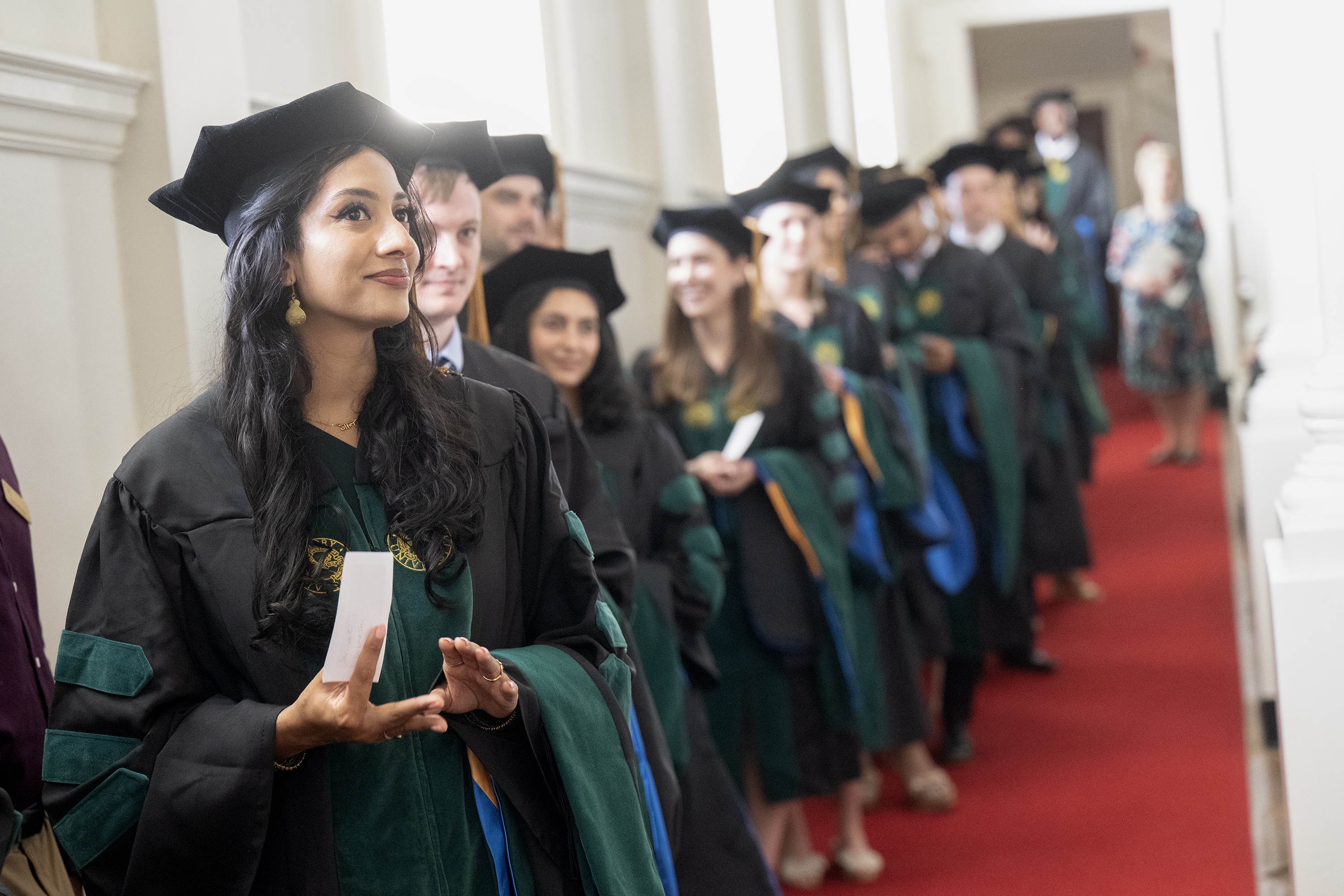 Graduates in cap and gown lined up