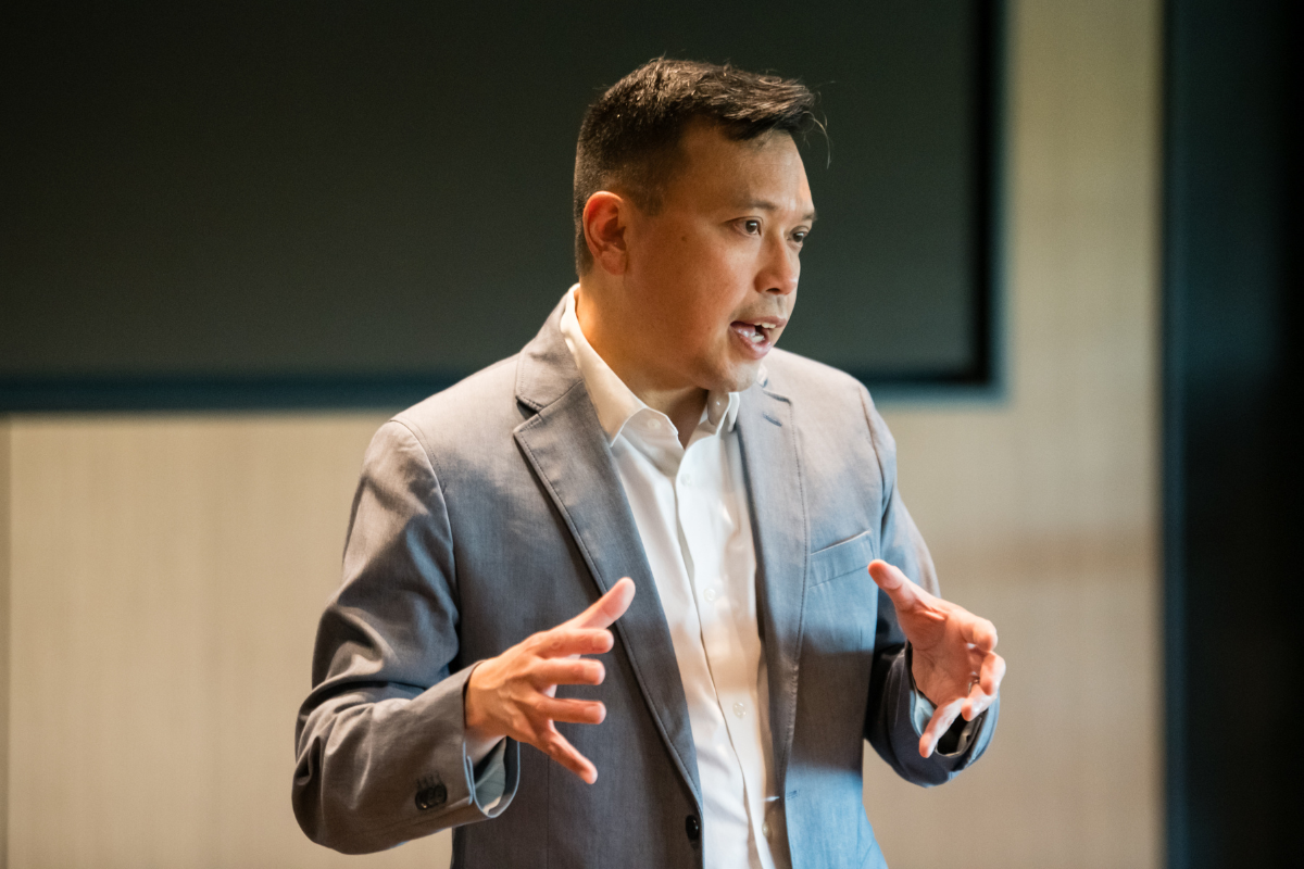 Wilbur Lam addresses a crowd