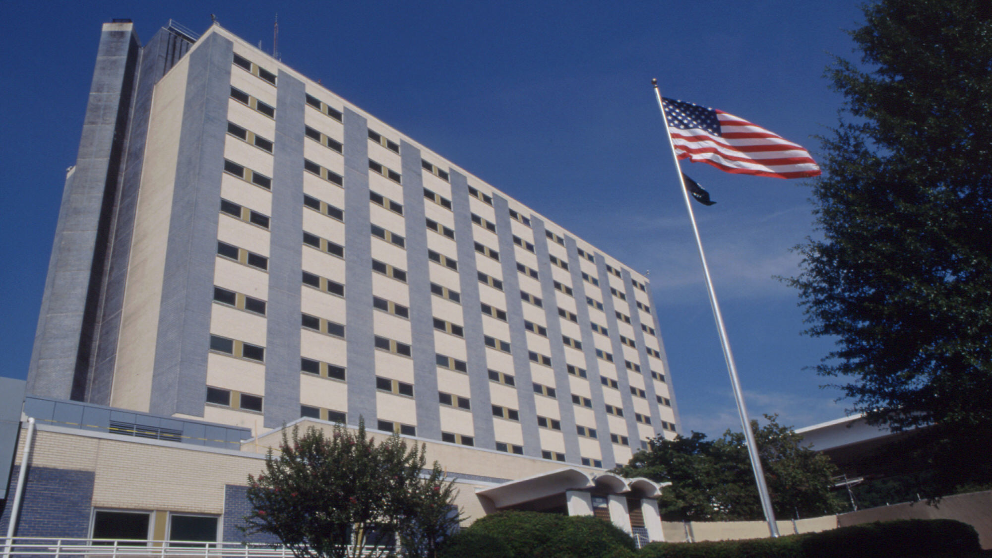 Building tower with US flag in front