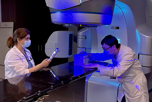 Medical physicists work with the MIMI phantom for imaging quality assurance.