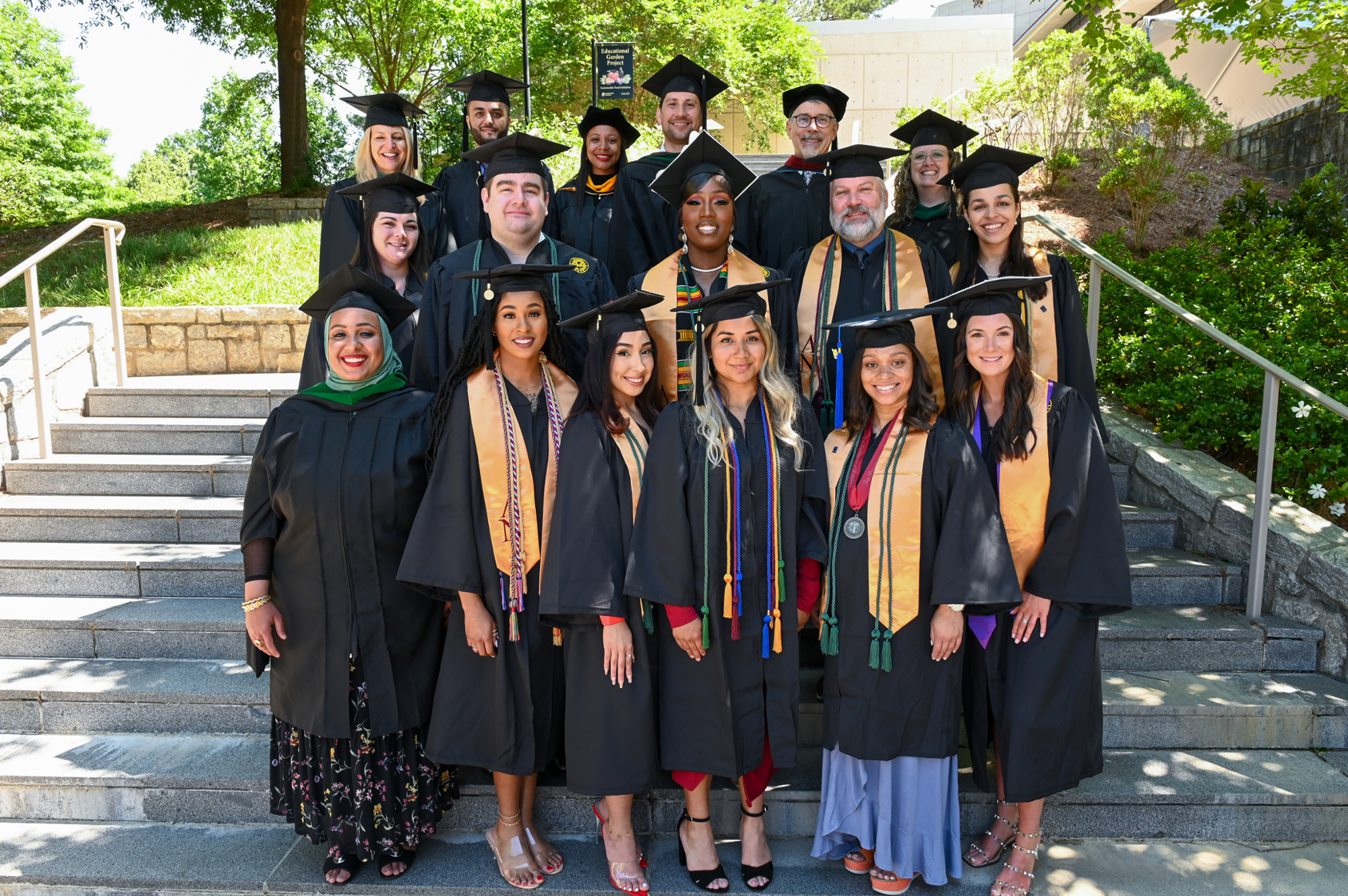 group of students and faculty in graduation regalia