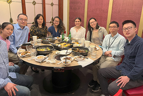 Yu lab group at dinner in May 2023